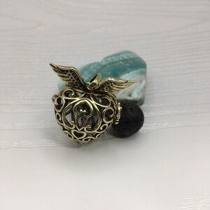 Heart & Wings Aromatherapy Brass tone Locket.  Lava stone included.